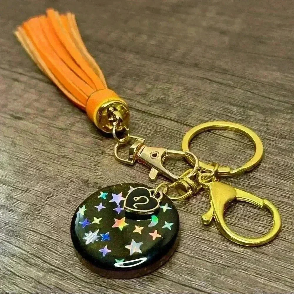 Hand Crafted Medallion Leo Charm and Orange Tassel Gold Tone Keychain